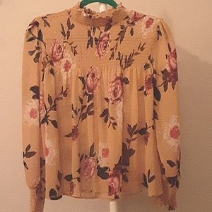 About a girl floral blouse.